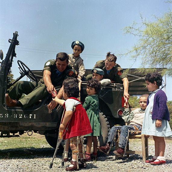 Soldiers helping children